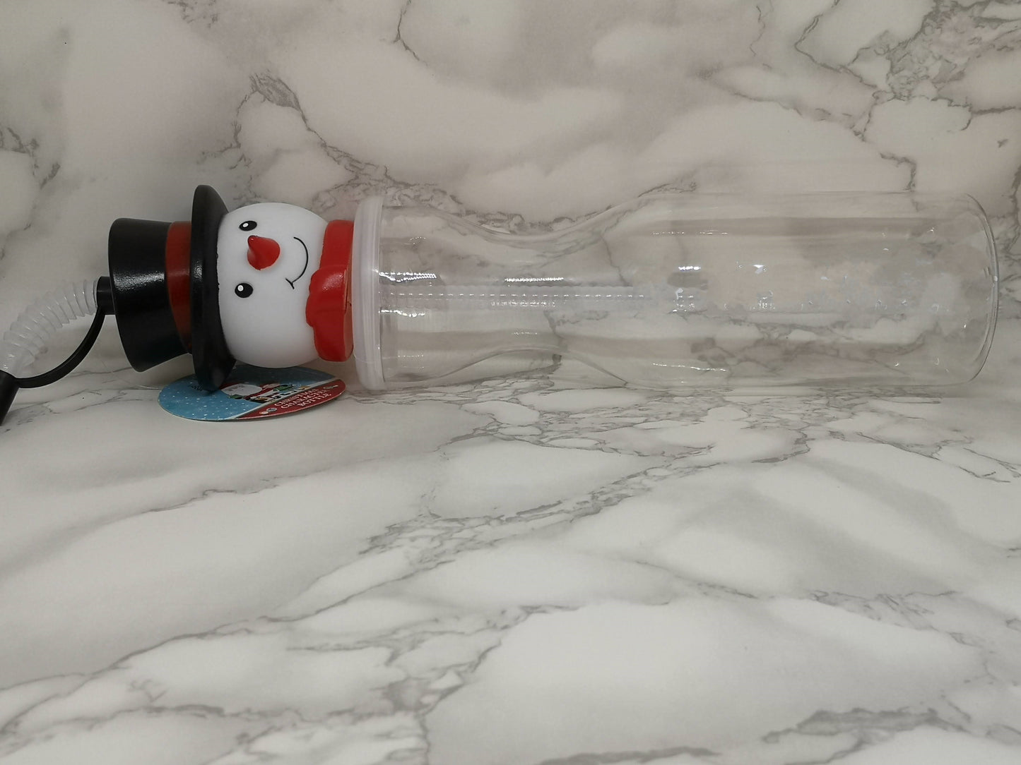 Snowman drinks bottle